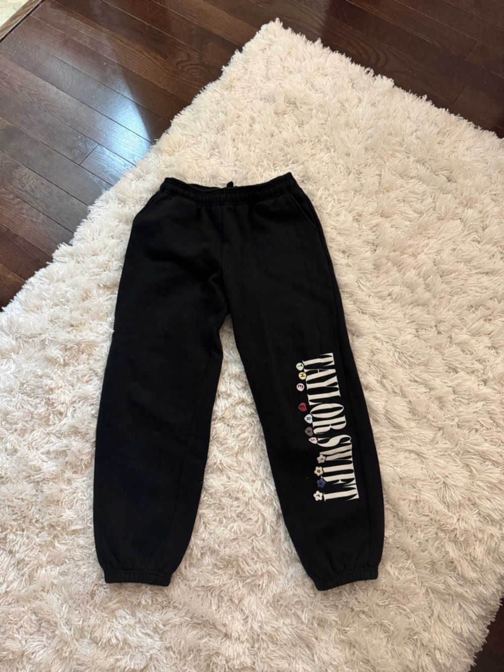 Taylor Swift Black Joggers with White Logo and Multicolor Icons